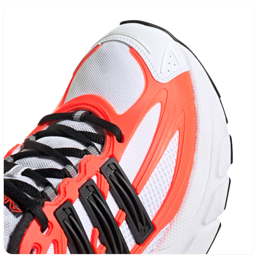 adidas Ozelia White Sneakers with Orange and Black Accents