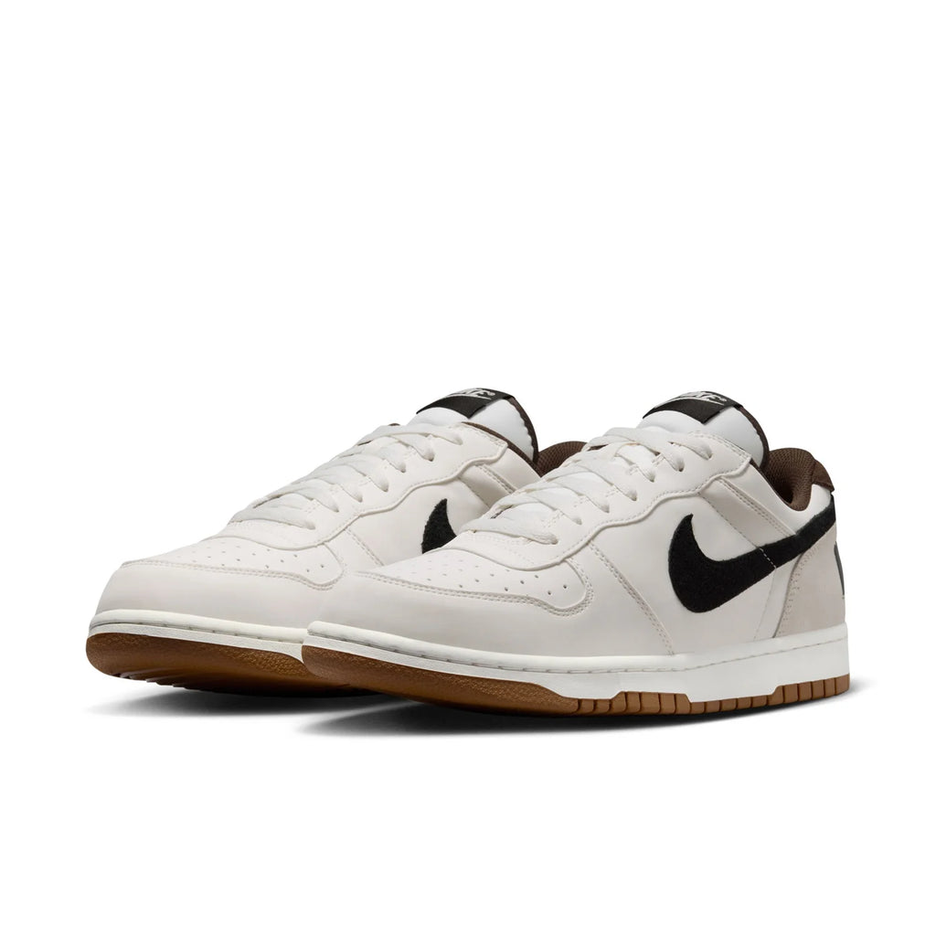 Nike White Low-Top Sneakers with Black Swoosh and Gum Sole
