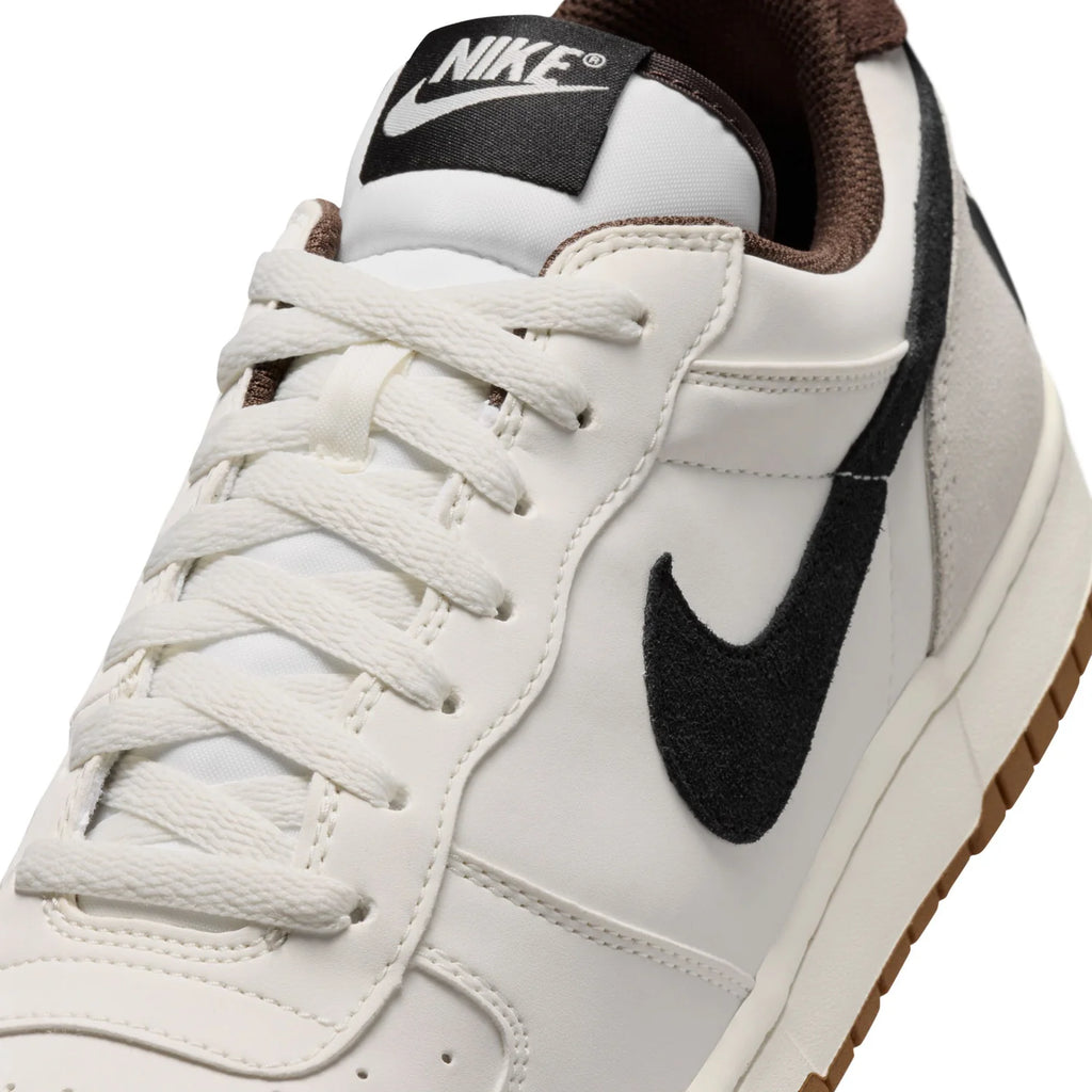 Nike White Low-Top Sneakers with Black Swoosh and Gum Sole