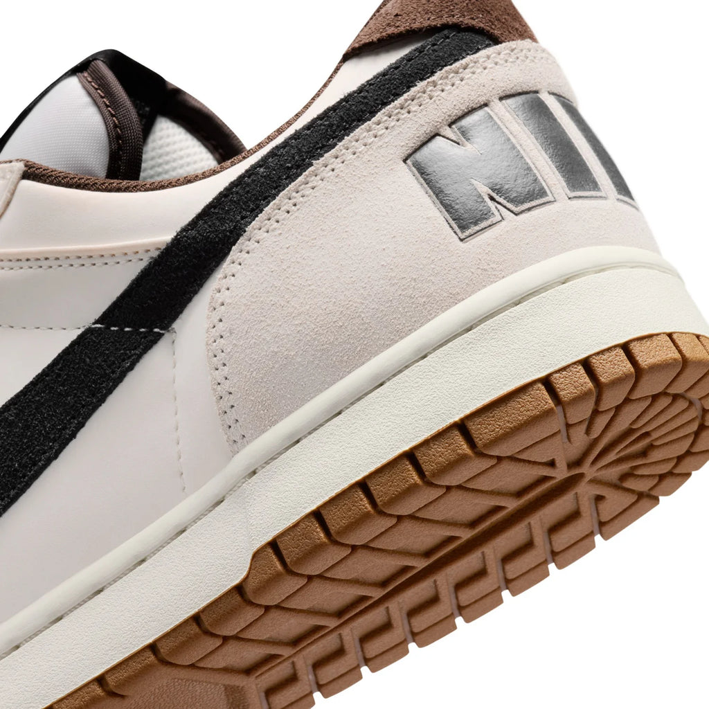 Nike White Low-Top Sneakers with Black Swoosh and Gum Sole